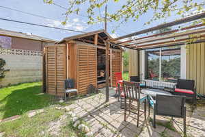 View of patio / terrace with a storage unit