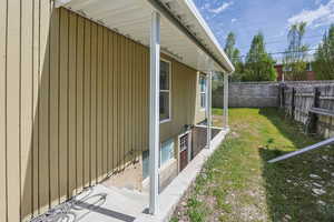 View of property exterior with a fenced backyard