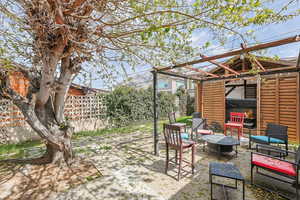Fenced backyard with a patio