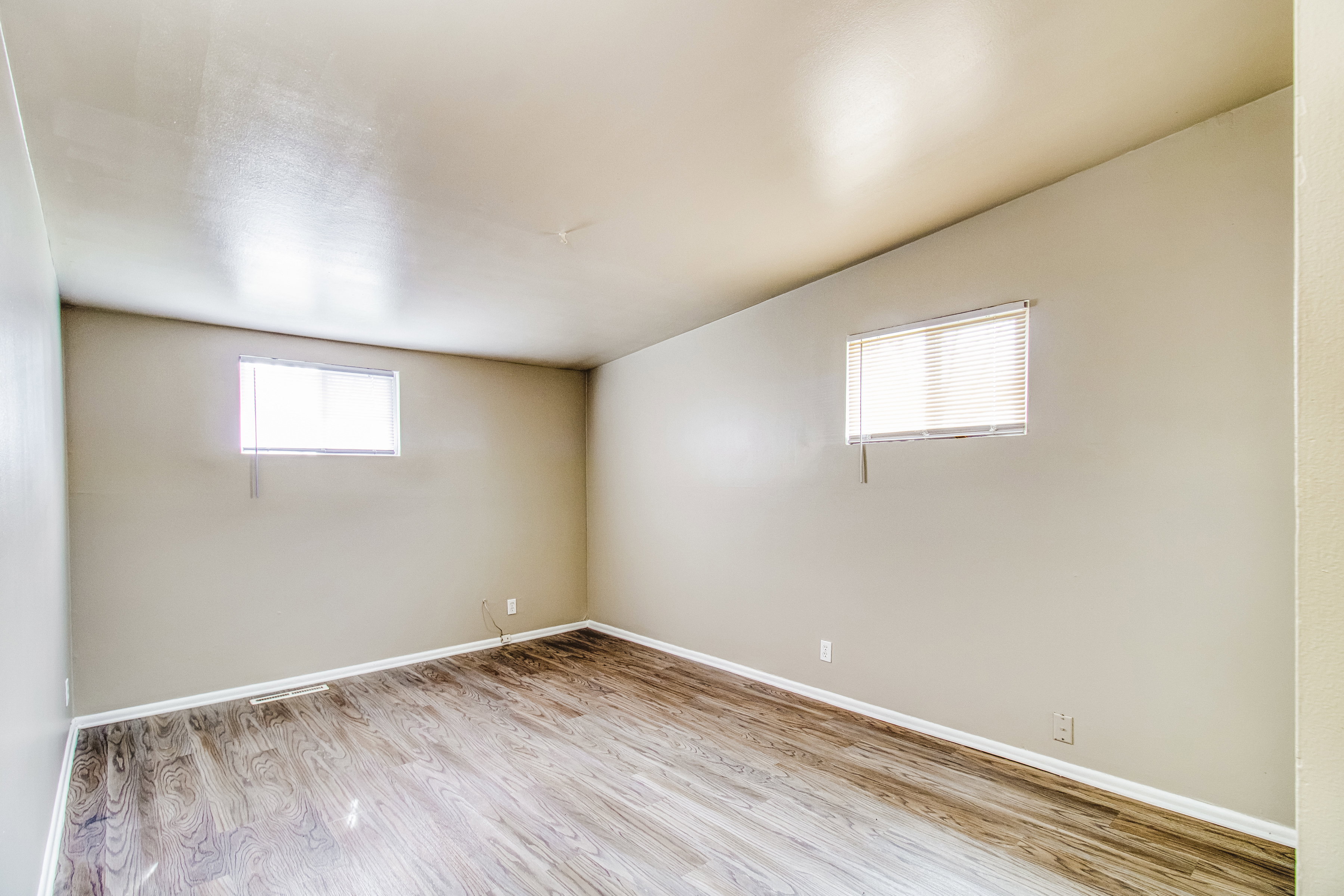 Unfurnished room featuring light wood-style floors and baseboards