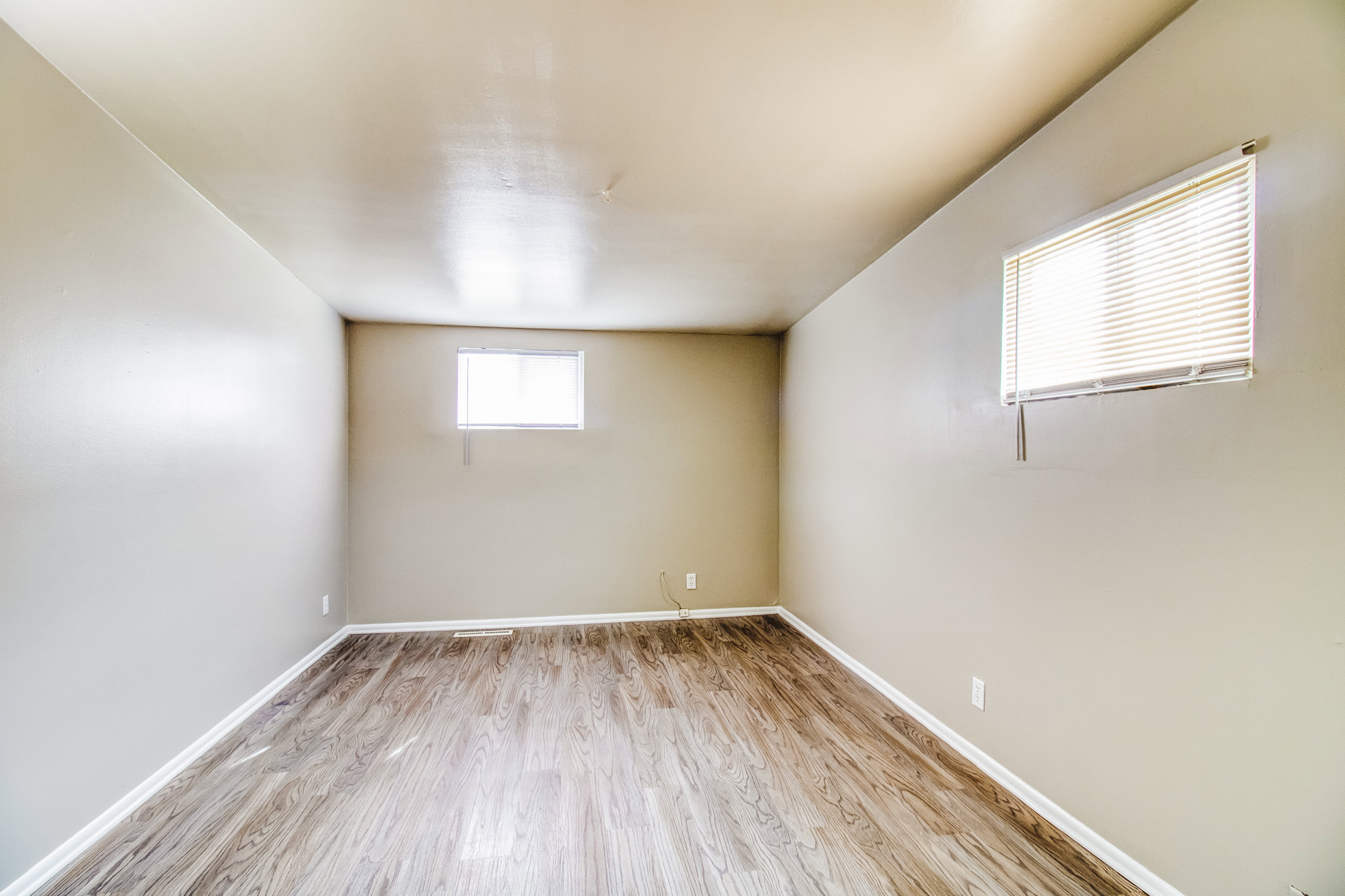 Empty room featuring light wood finished floors and baseboards