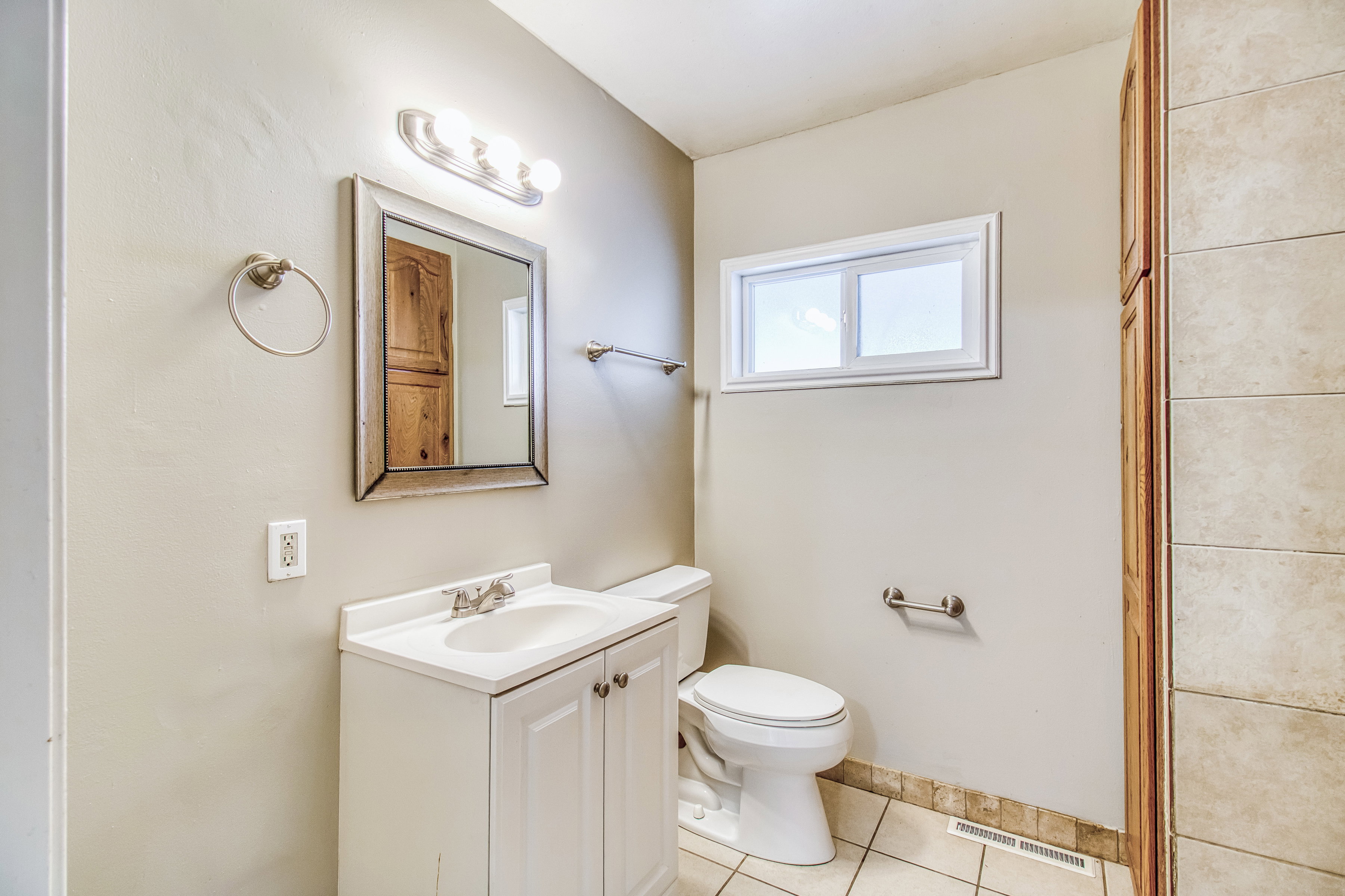 Bathroom featuring vanity and light tile patterned floors