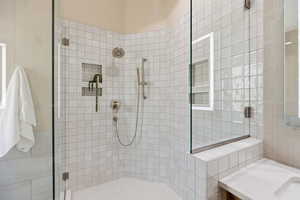 Bathroom with a stall shower and vanity