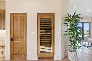 Detailed view of wood finished floors and recessed lighting