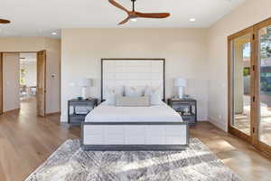 Bedroom with access to exterior, light wood-style flooring, recessed lighting, and a ceiling fan