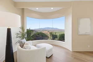 Sitting room featuring a mountain view and wood finished floors