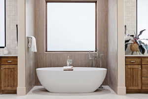 Bathroom featuring vanity and a freestanding tub