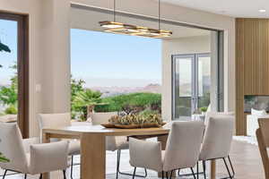 Dining space with a mountain view and light wood-type flooring
