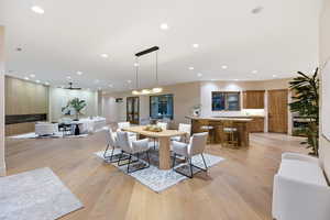 Dining area featuring light wood-style floors and recessed lighting