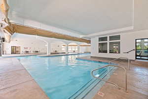 Indoor community pool with a patio area