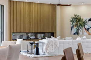 Living room featuring wood finished floors and recessed lighting