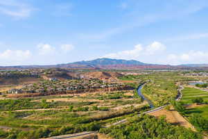View of mountain background with a large body of water and nearby suburban area