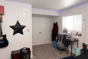 Bedroom with light colored carpet