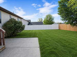 View of fenced backyard