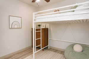 Bedroom featuring light wood-style flooring and a ceiling fan