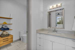 Bathroom with toilet and vanity