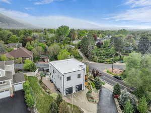 Aerial perspective of suburban area featuring a mountainous background