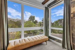 Sunroom / solarium with a mountain view
