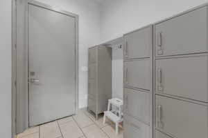 Mudroom featuring light tile patterned flooring