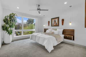 Bedroom featuring light colored carpet, recessed lighting, and ceiling fan