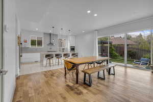 Dining room with recessed lighting and light wood-style floors