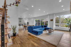 Living area featuring recessed lighting and hardwood / wood-style flooring