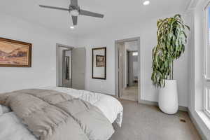 Bedroom featuring light carpet, recessed lighting, and ceiling fan