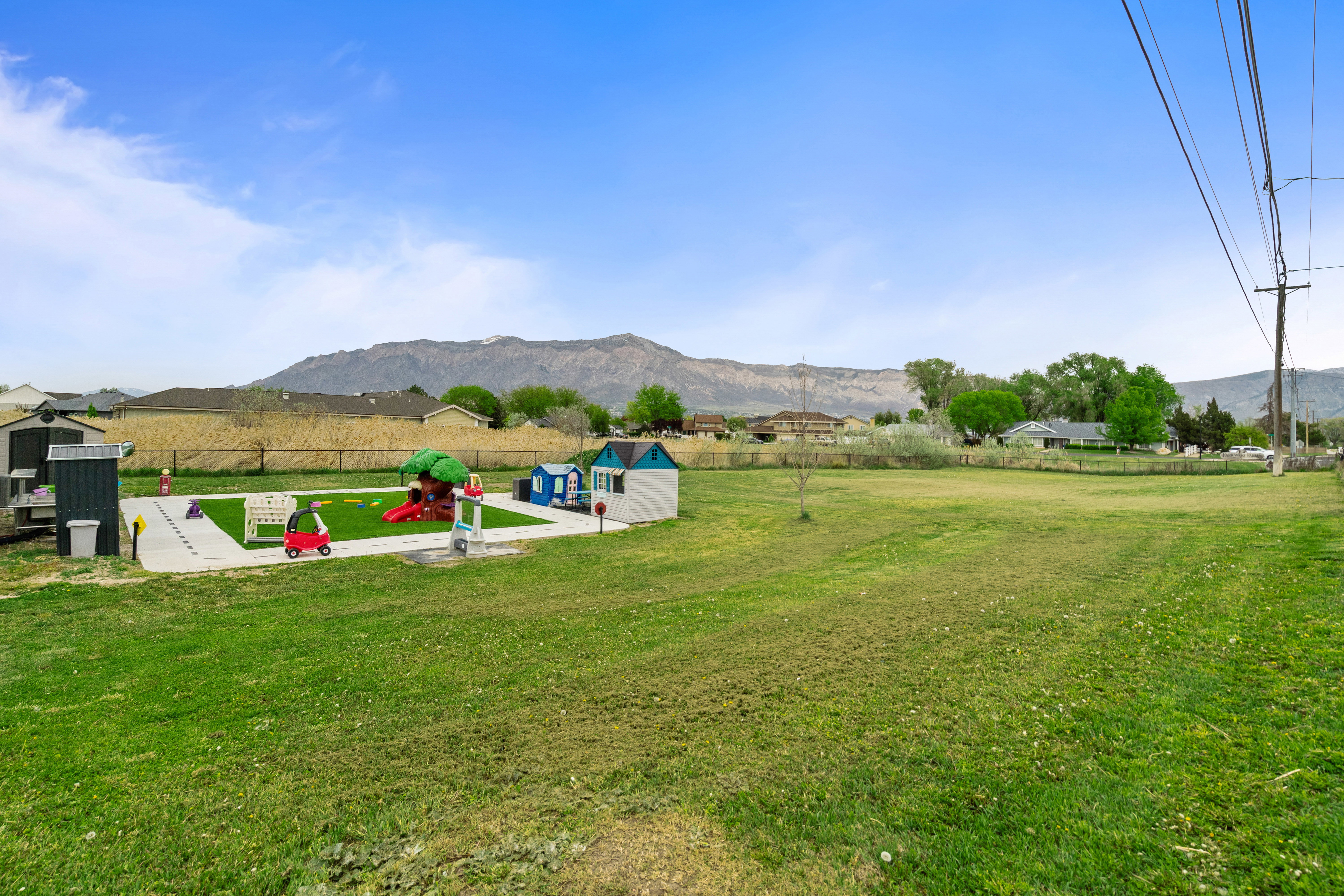 View of yard featuring a mountain view and an outbuilding