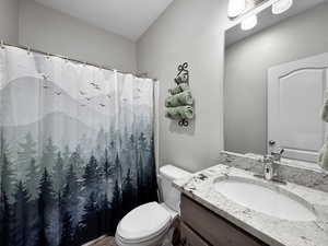 Bathroom featuring vanity and a shower with curtain