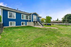 Back of property featuring stairs