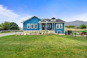 Bungalow-style home with covered porch and board and batten siding