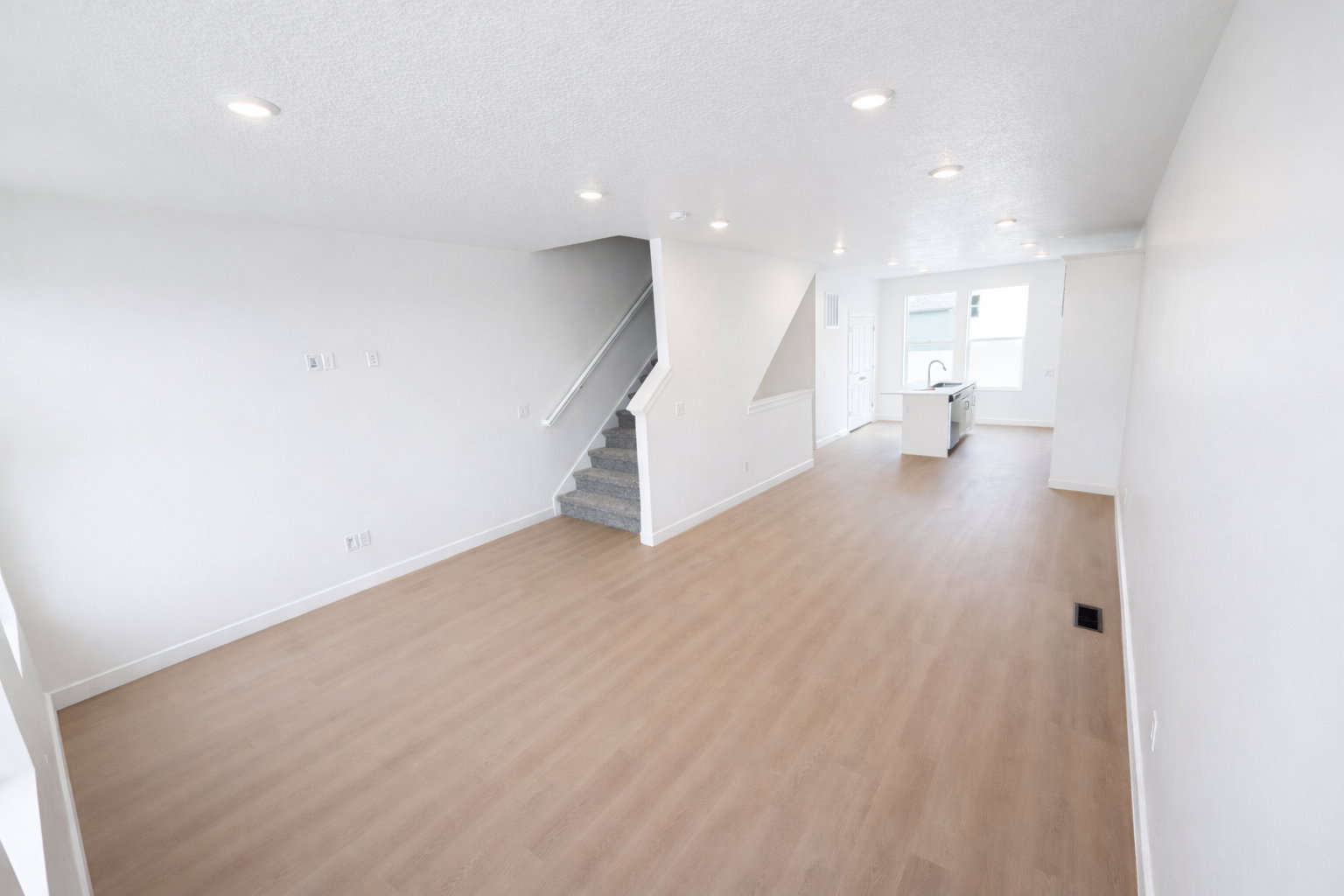 Unfurnished room with light wood finished floors, recessed lighting, and a textured ceiling