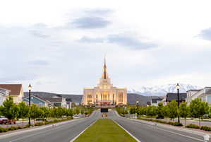 View of asphalt road featuring street lighting, a mountain view, and a residential view