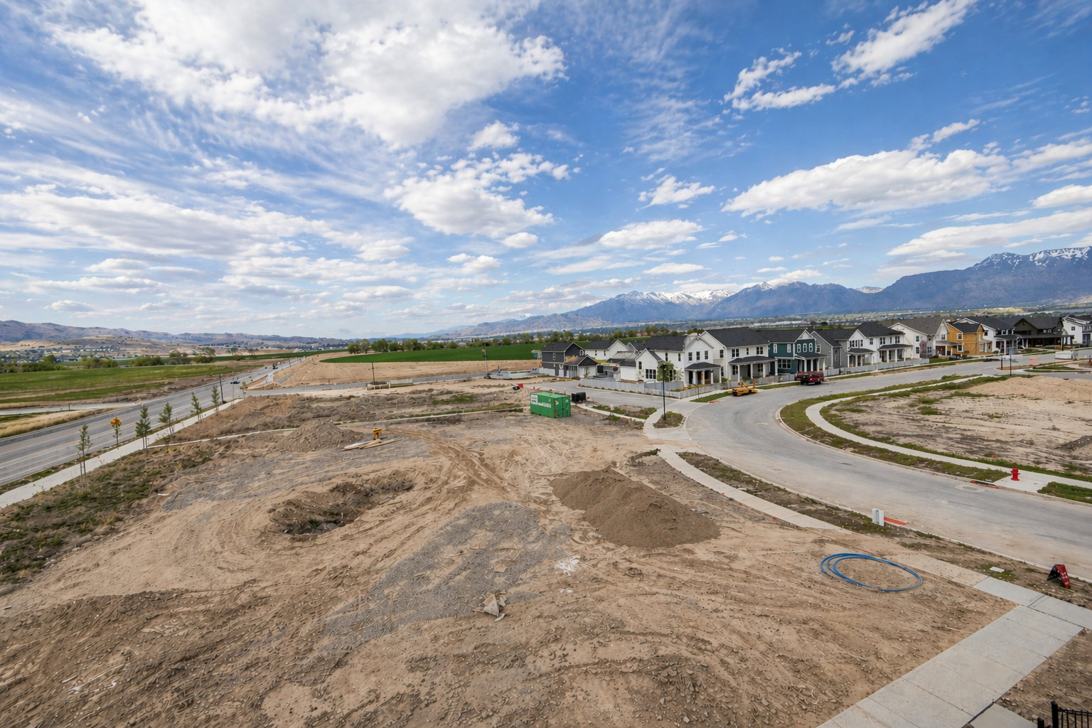 Aerial perspective of suburban area featuring a mountainous background