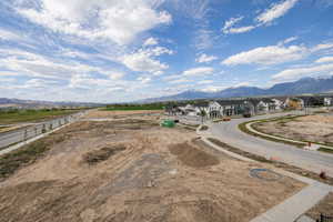 Aerial perspective of suburban area featuring a mountainous background