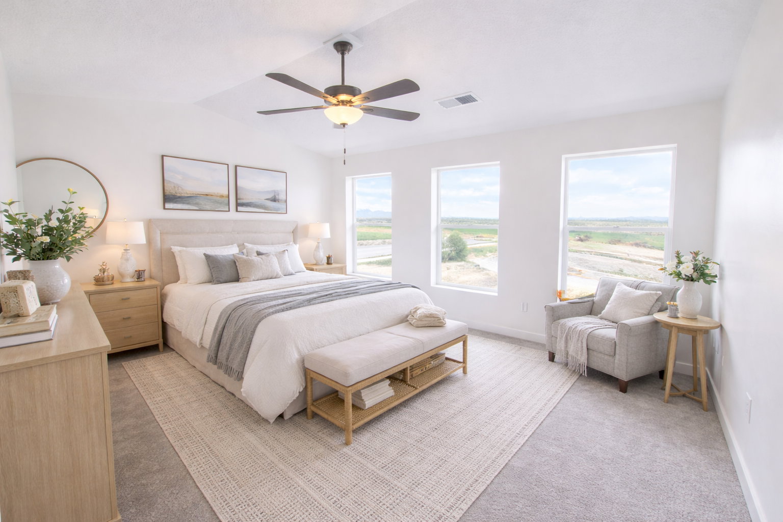 Bedroom featuring a ceiling fan and light colored carpet