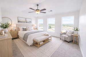 Bedroom featuring a ceiling fan and light colored carpet