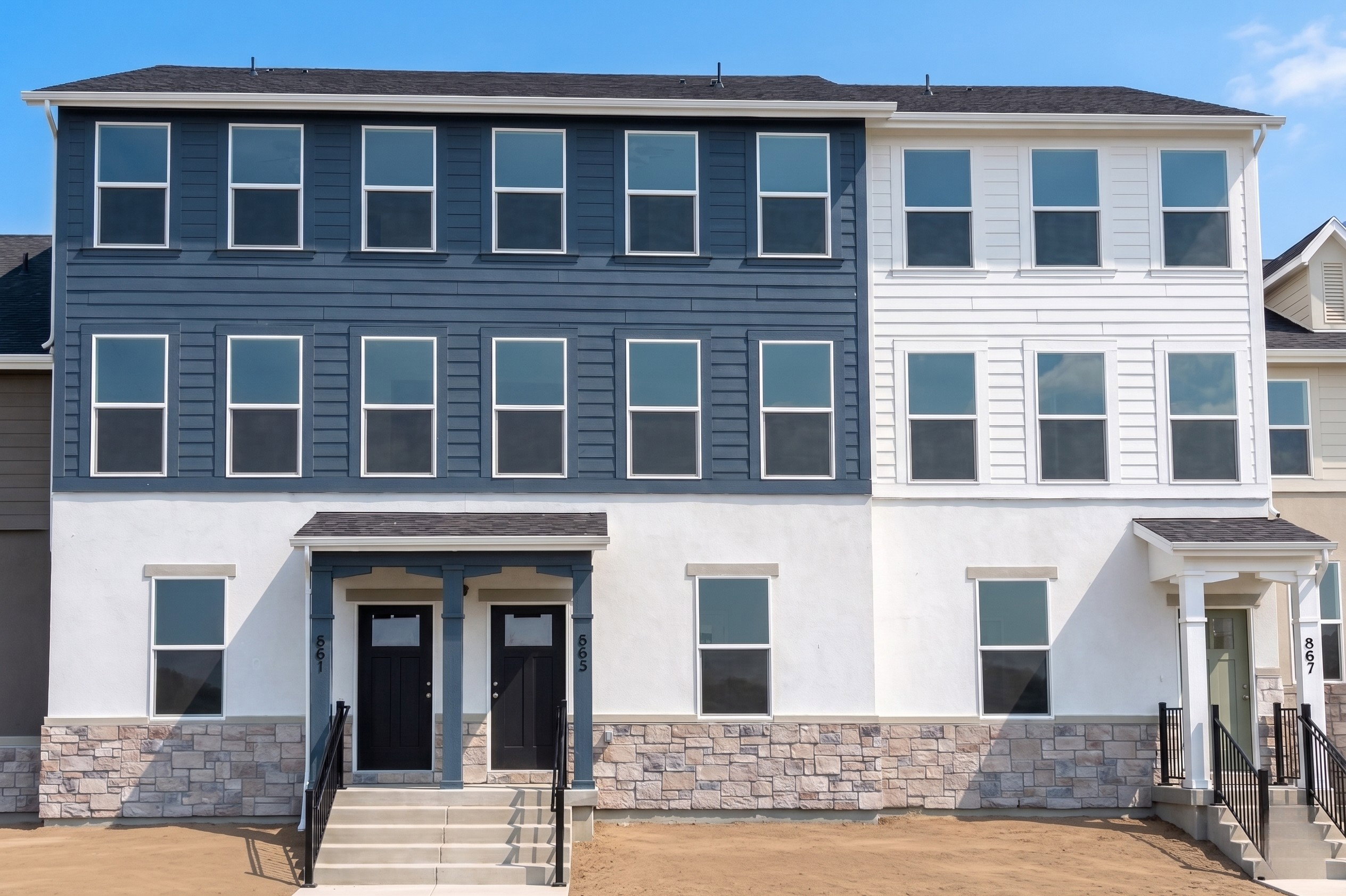 Modern townhome exterior with mixed material facade