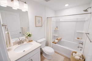 Full bathroom with vanity and shower / bath combo