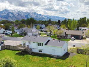 Aerial perspective of suburban area featuring a mountain backdrop