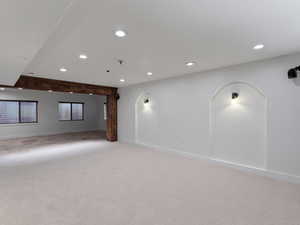 Spare room with recessed lighting and light colored carpet