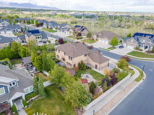 Aerial perspective of suburban area with a mountainous background
