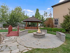 View of patio / terrace featuring a gazebo and an outdoor fire pit