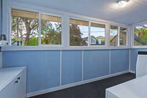 Unfurnished sunroom featuring washer / clothes dryer