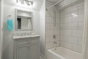 Full bath featuring vanity and shower / bath combo with shower curtain