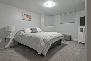 Carpeted bedroom with baseboards