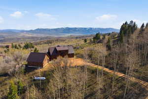 View of mountain backdrop with rural landscape