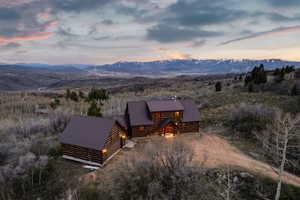 Exterior space featuring a mountain view and a metal roof