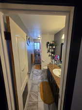 Bathroom featuring vanity and a textured ceiling