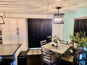 Dining area with a textured ceiling